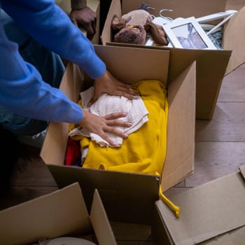 A First home owner packing boxes